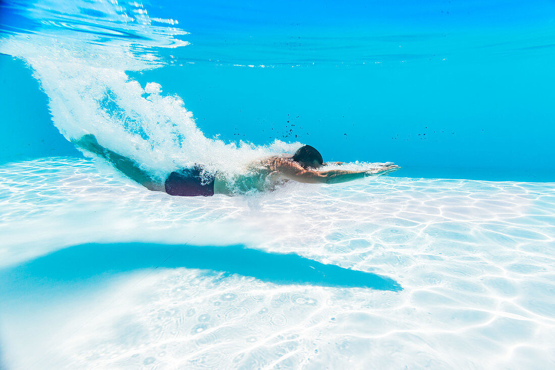 Man swimming in pool