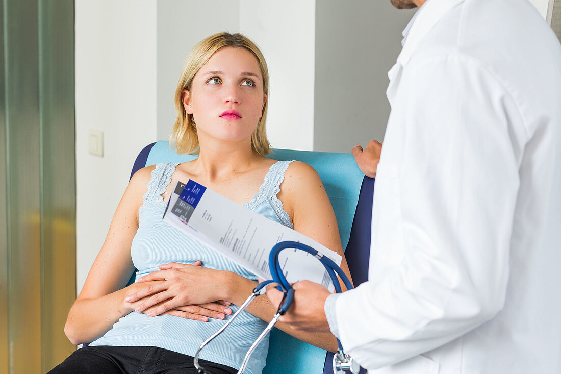 Doctor talking with a female patient