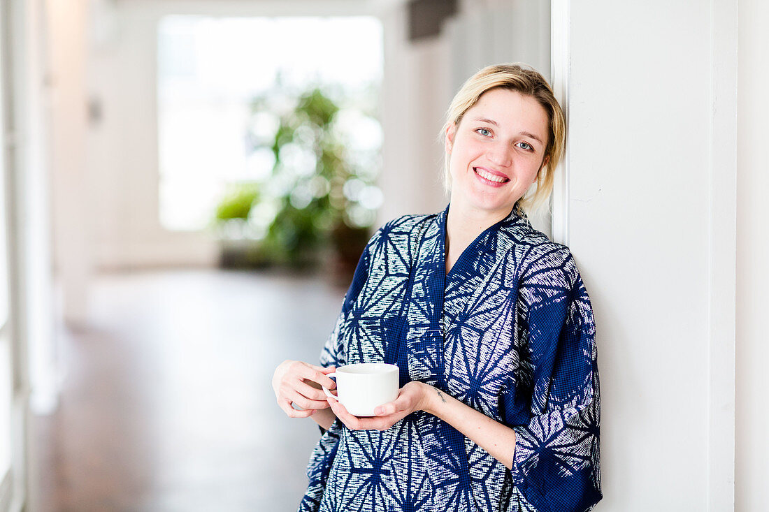 Woman drinking hot beverage