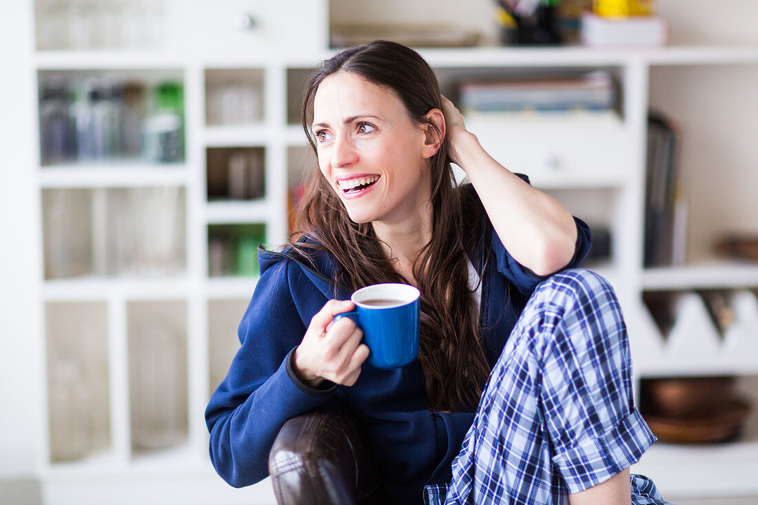 Woman drinking hot beverage