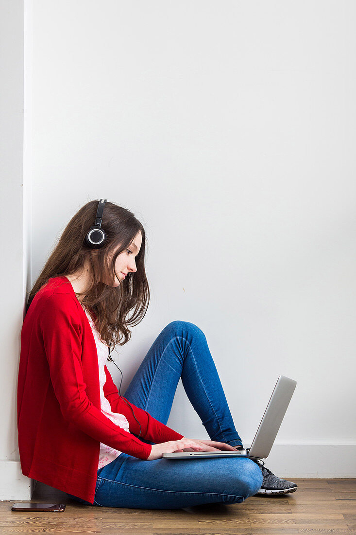 Teenager using a laptop