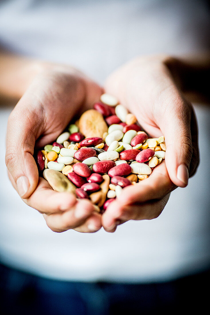 Woman holding assorted beans and pulse