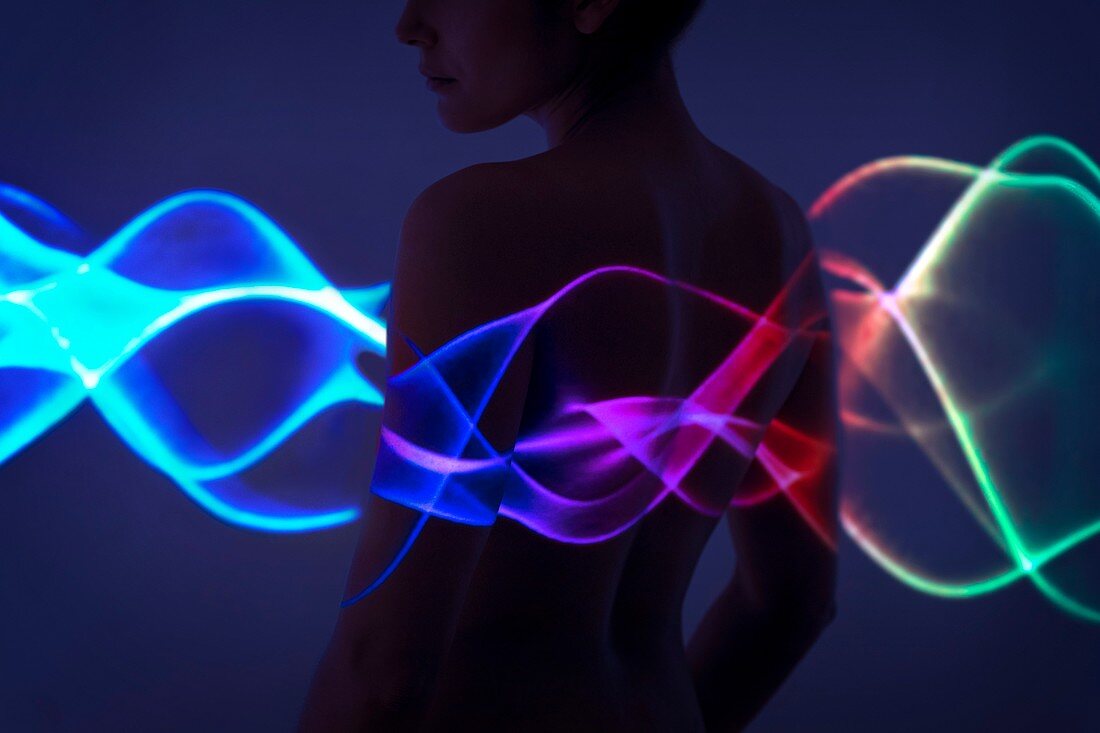 Woman with multicoloured lights on body