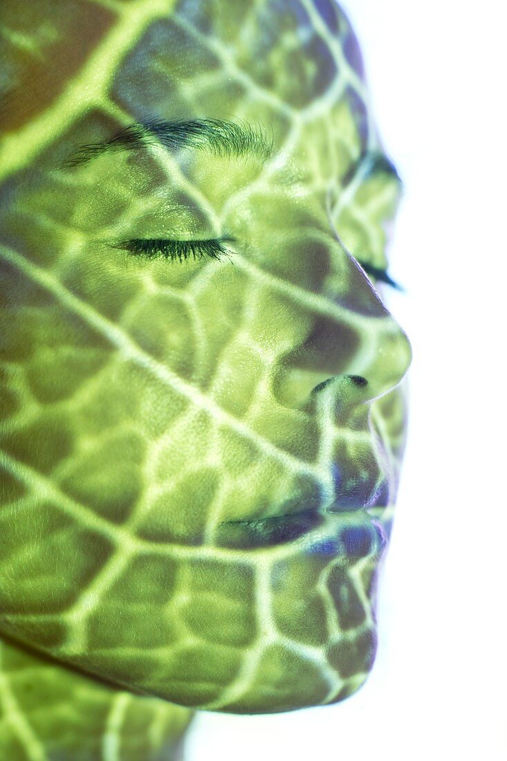 Woman with green pattern projected on face