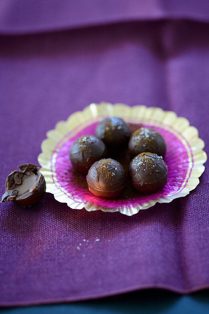 chocolate pralines on a purple wrapper