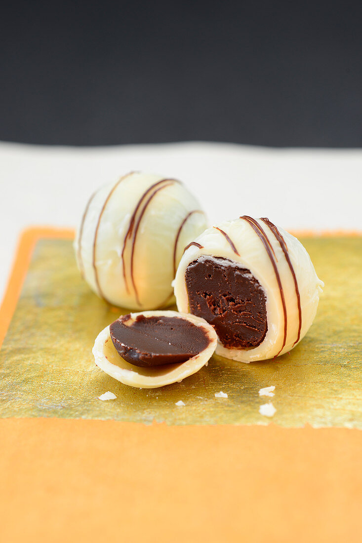 White truffle pralines with fine chocolate stripes