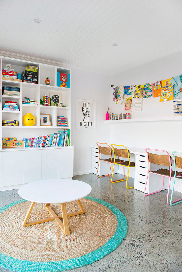 Colorful color accents in the white playroom