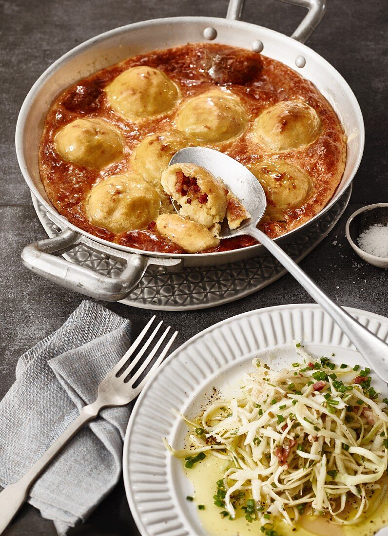 Baked bacon dumplings with a bacon and cabbage salad