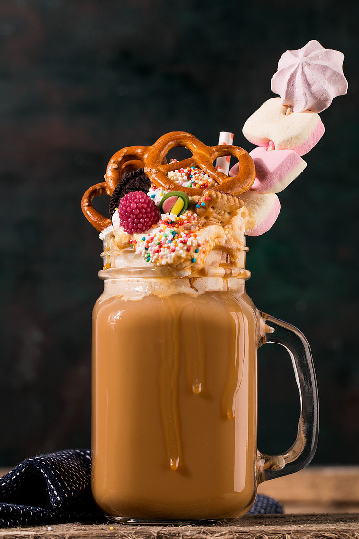 A freak shake with coffee, cream and colourful sweets