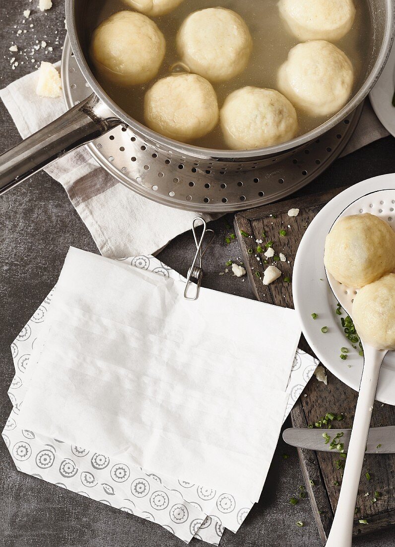 Potato dumplings cooking in a pan