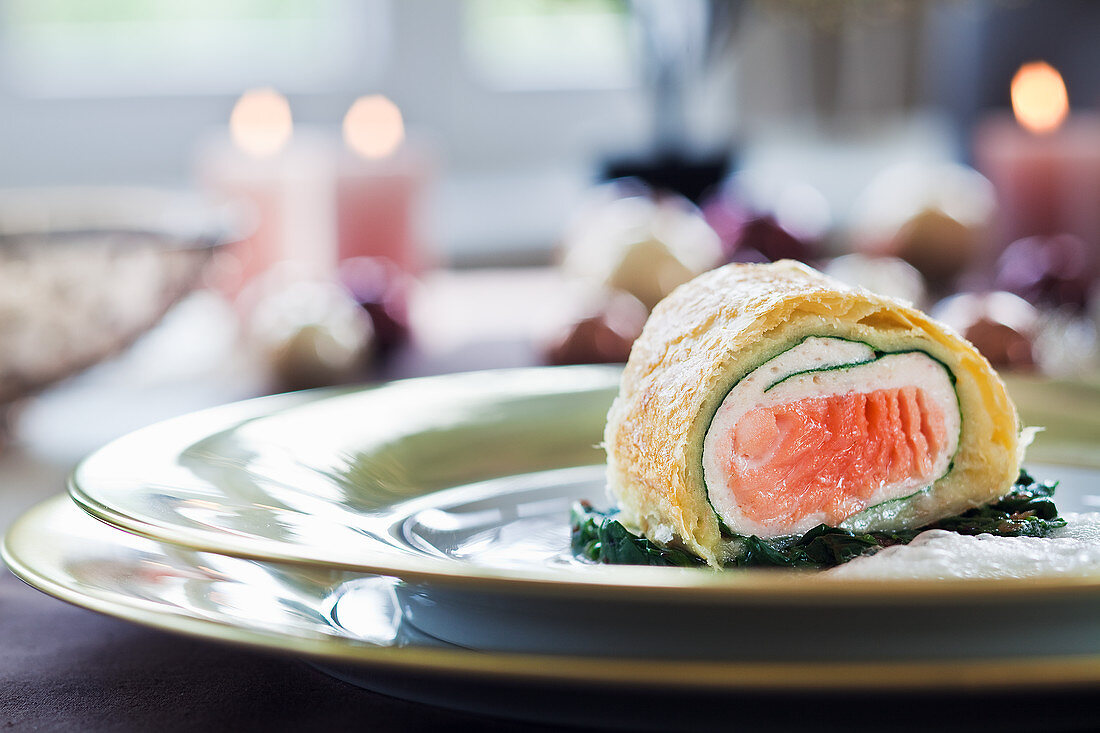 Salmon strudel on spinach for Christmas