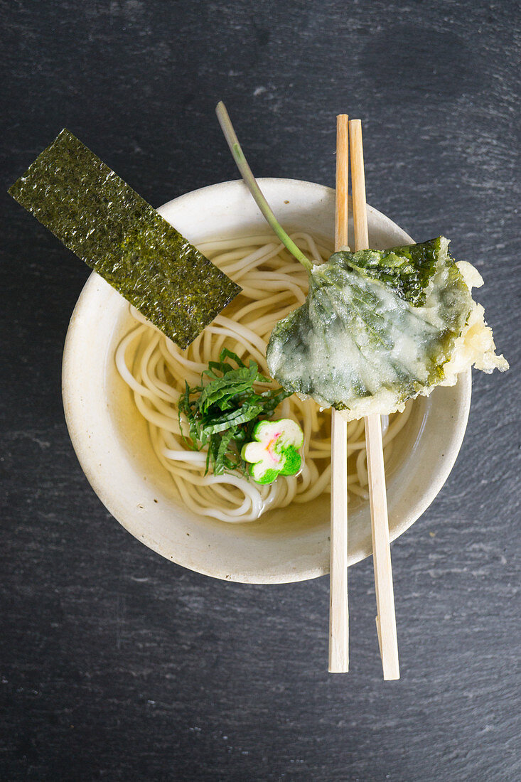 Ramen noodle soup with nori and wasabi leaf tempura
