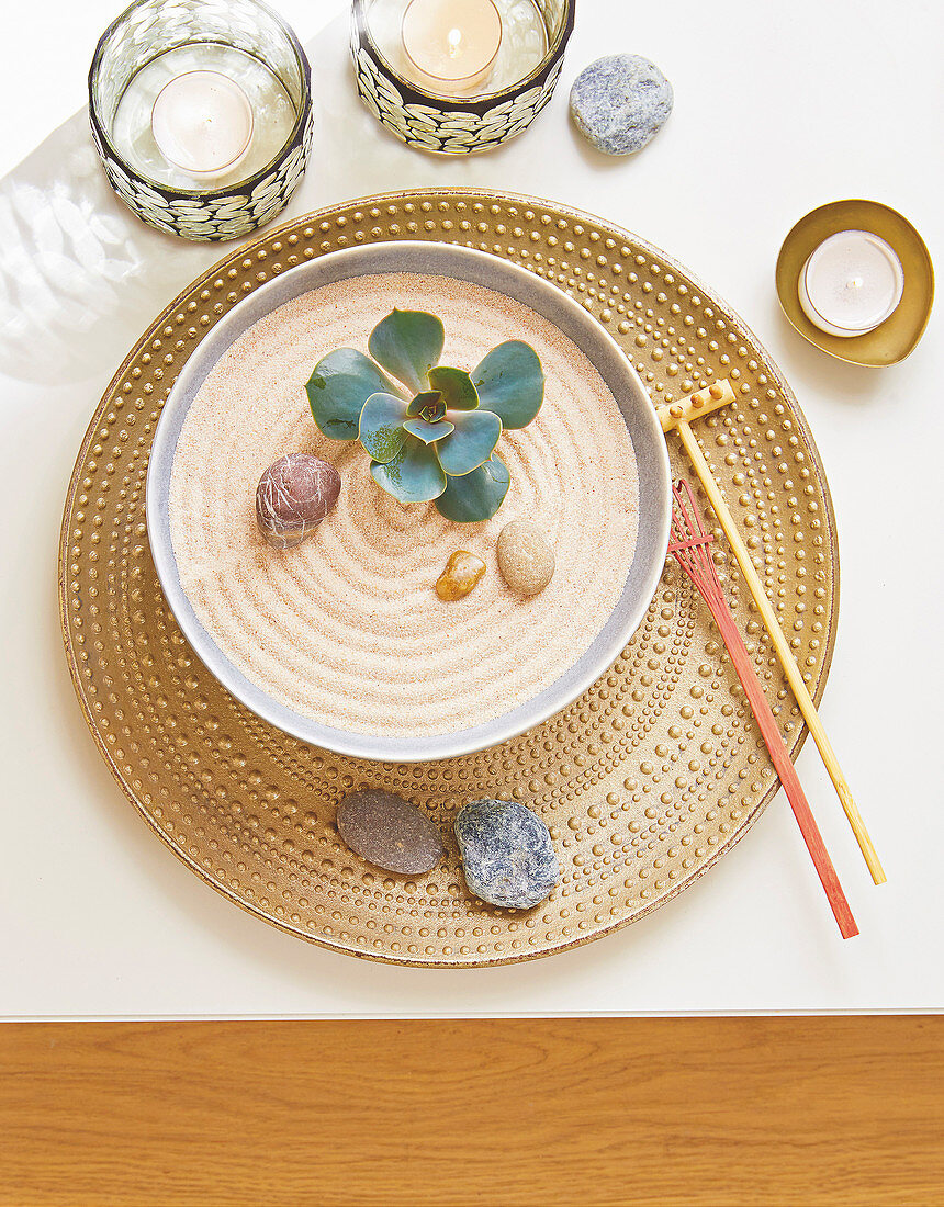 A mini Zen garden in a bowl as table decoration