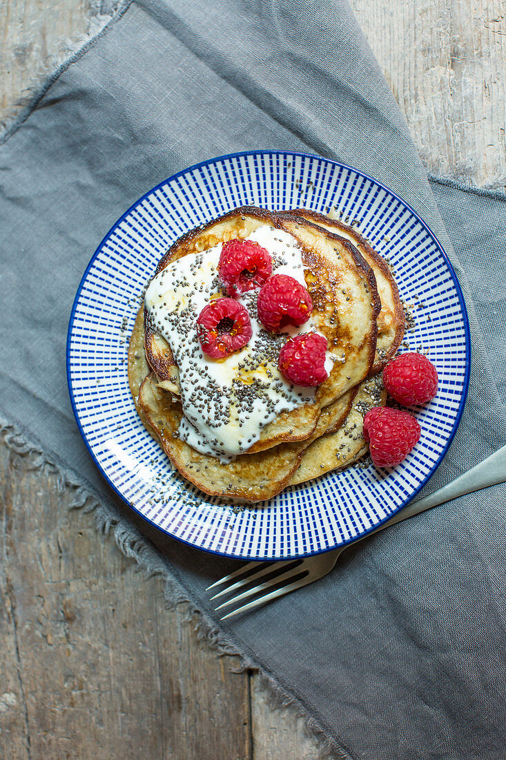 Gluten-free banana pancakes with raspberries and chia seeds