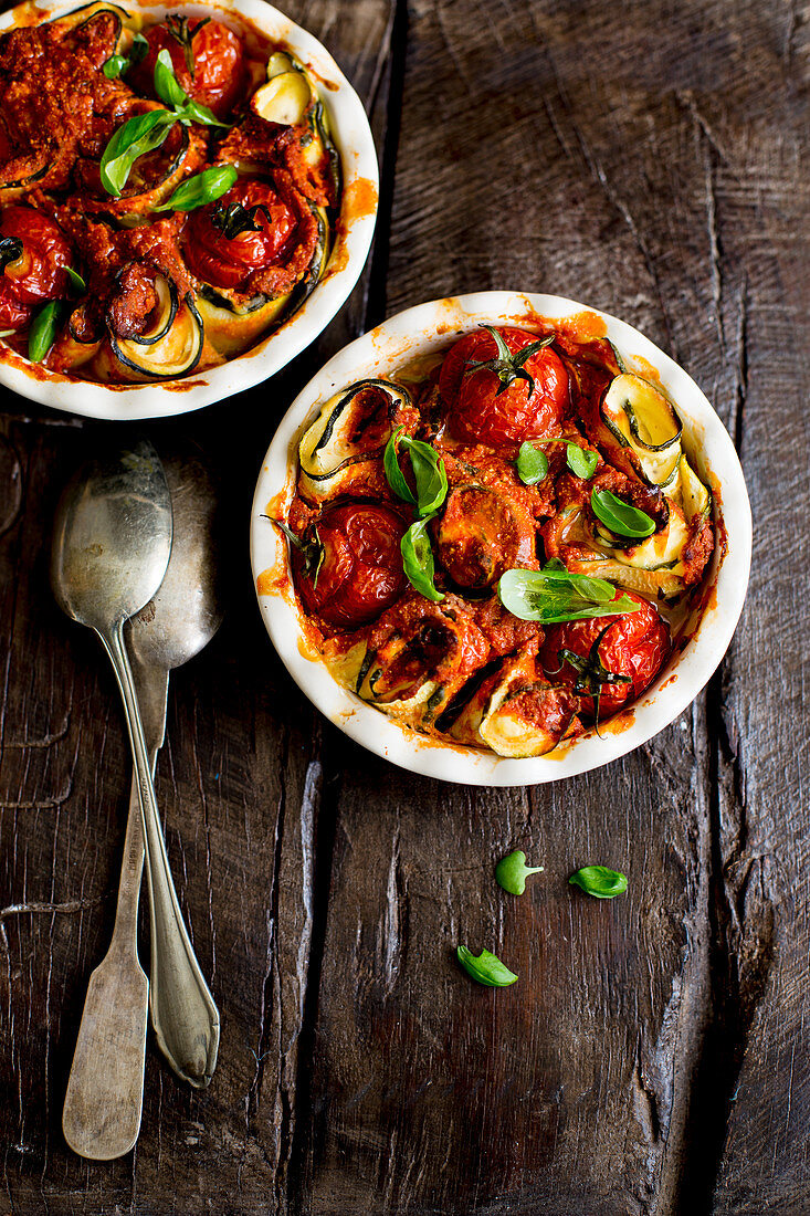 Slices of courgette rolled around tomatoes and basil