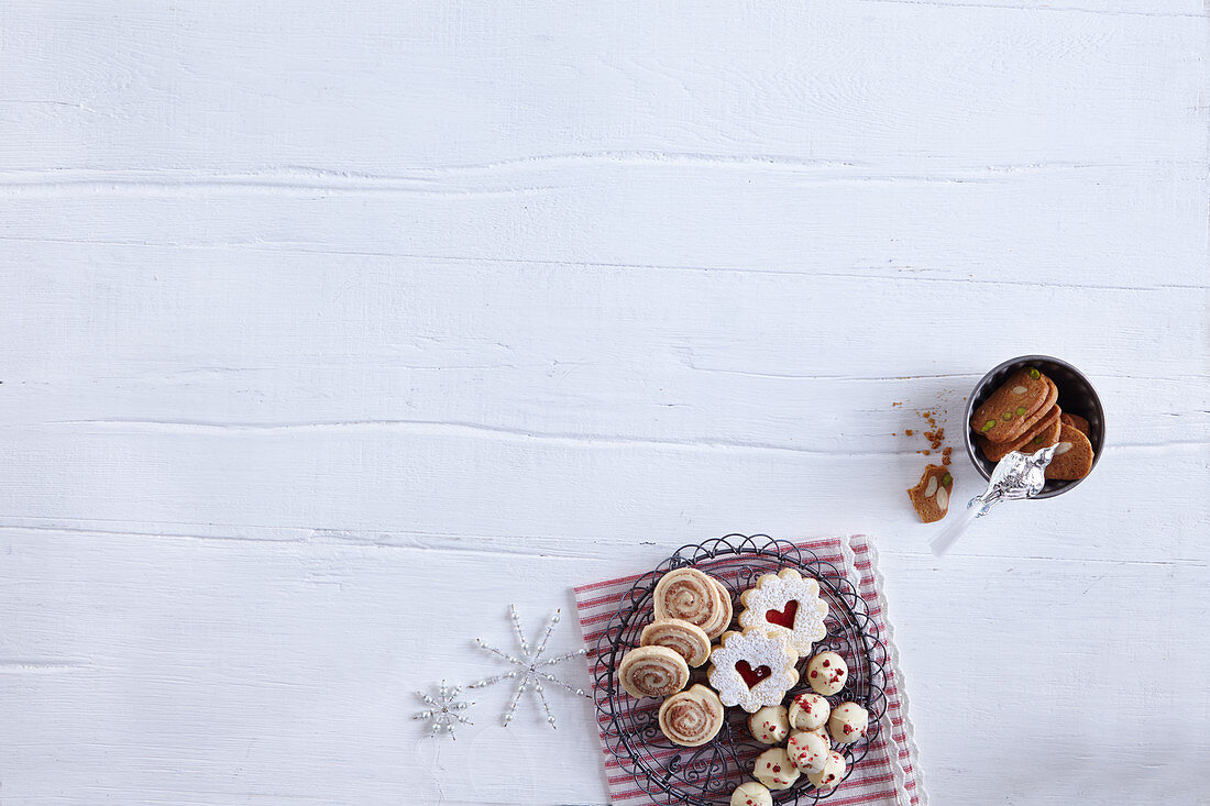 Various Christmas biscuits on a white surface