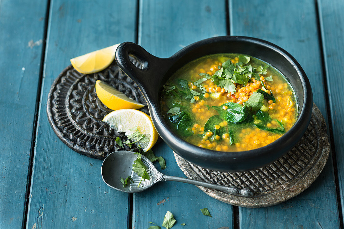 Indian lentil soup with spinach and turmeric