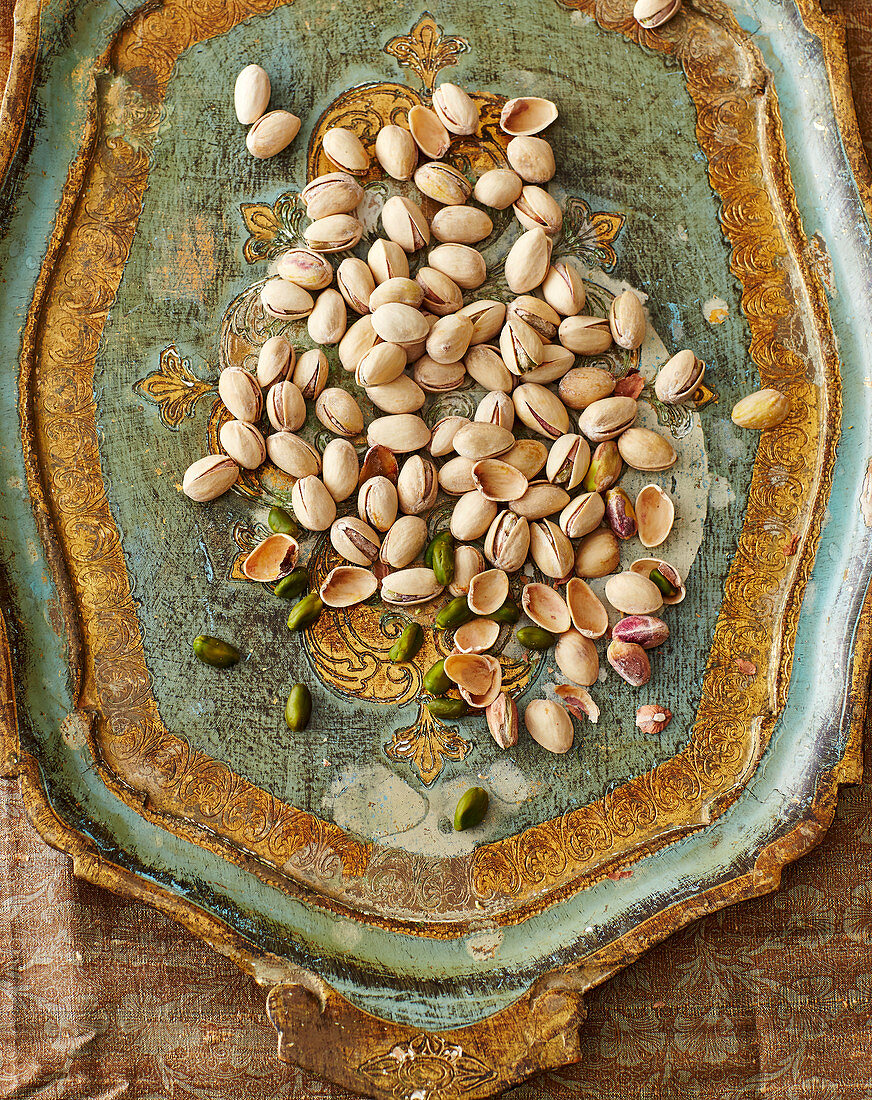 Pistachios on an oriental wooden tray