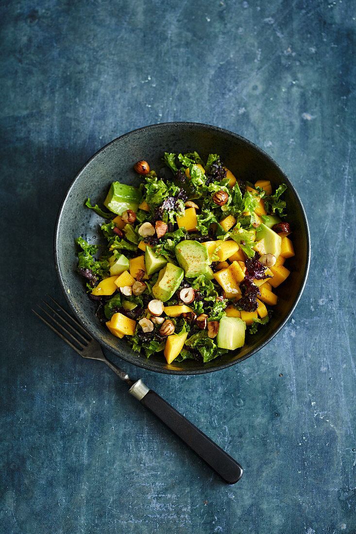 Freekah and avocado salad with mango and hazelnuts