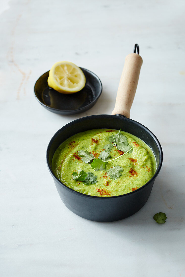 Broccoli and avocado soup with coriander and turmeric