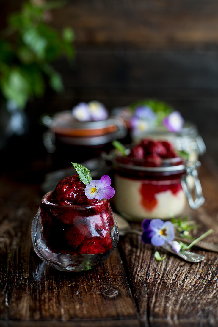 Cheesecake baked in a glass and topped with strawberries