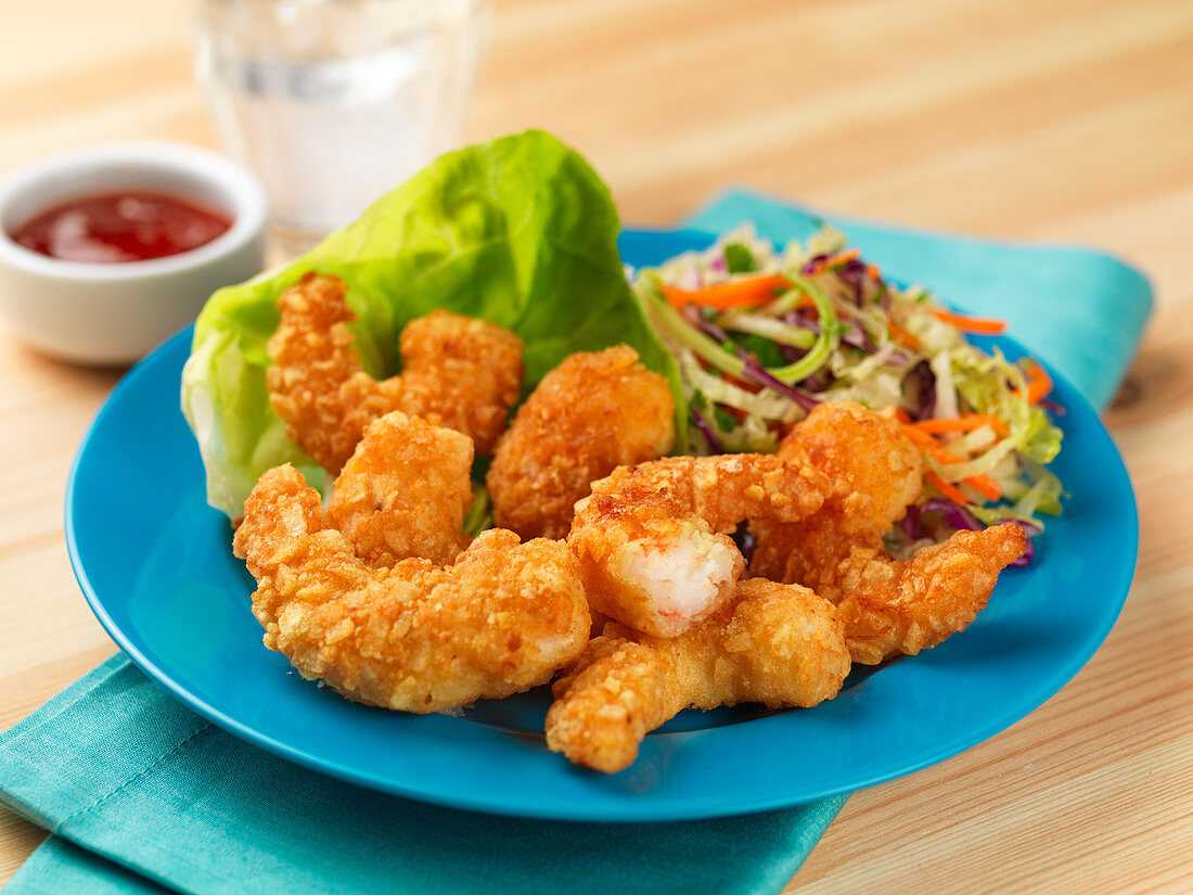 Fried prawns in breadcrumbs with salad