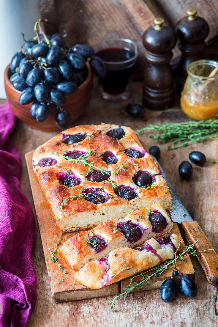 Focaccia with grapes and thyme, sliced