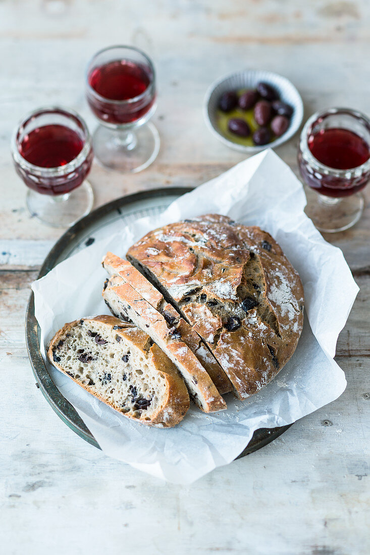 Crusty olive bread and red wine