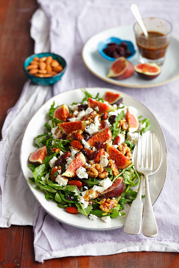 Salad with figs, feta, cranberry and almonds plus walnuts fried with honey