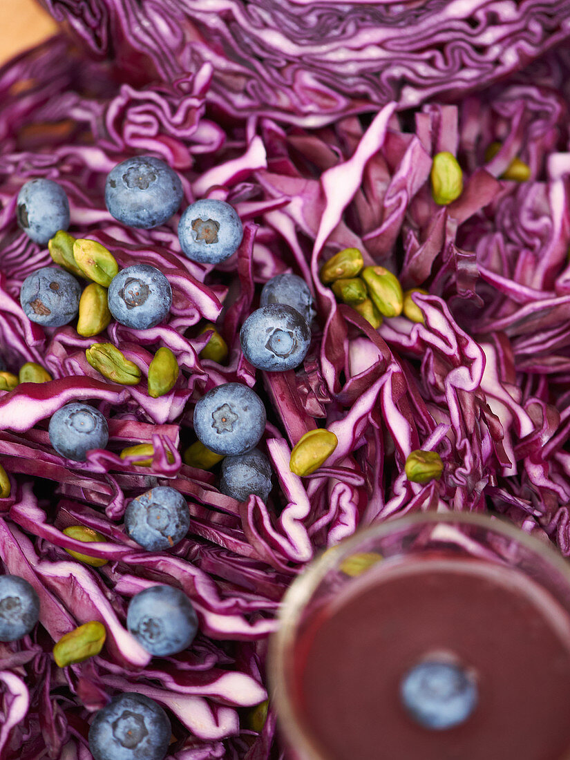 Red cabbage salad with blueberries and pistachio kernels