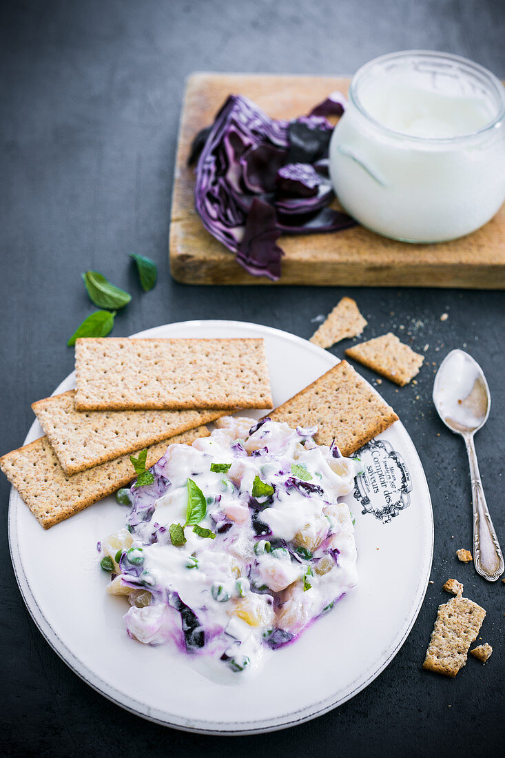 Red cabbage salad with peas and yoghurt dressing