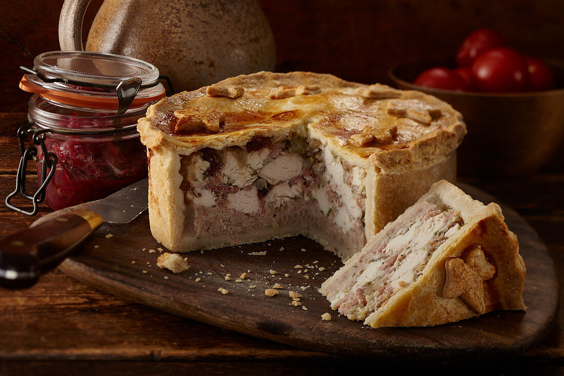 A meat pie with red onion chutney