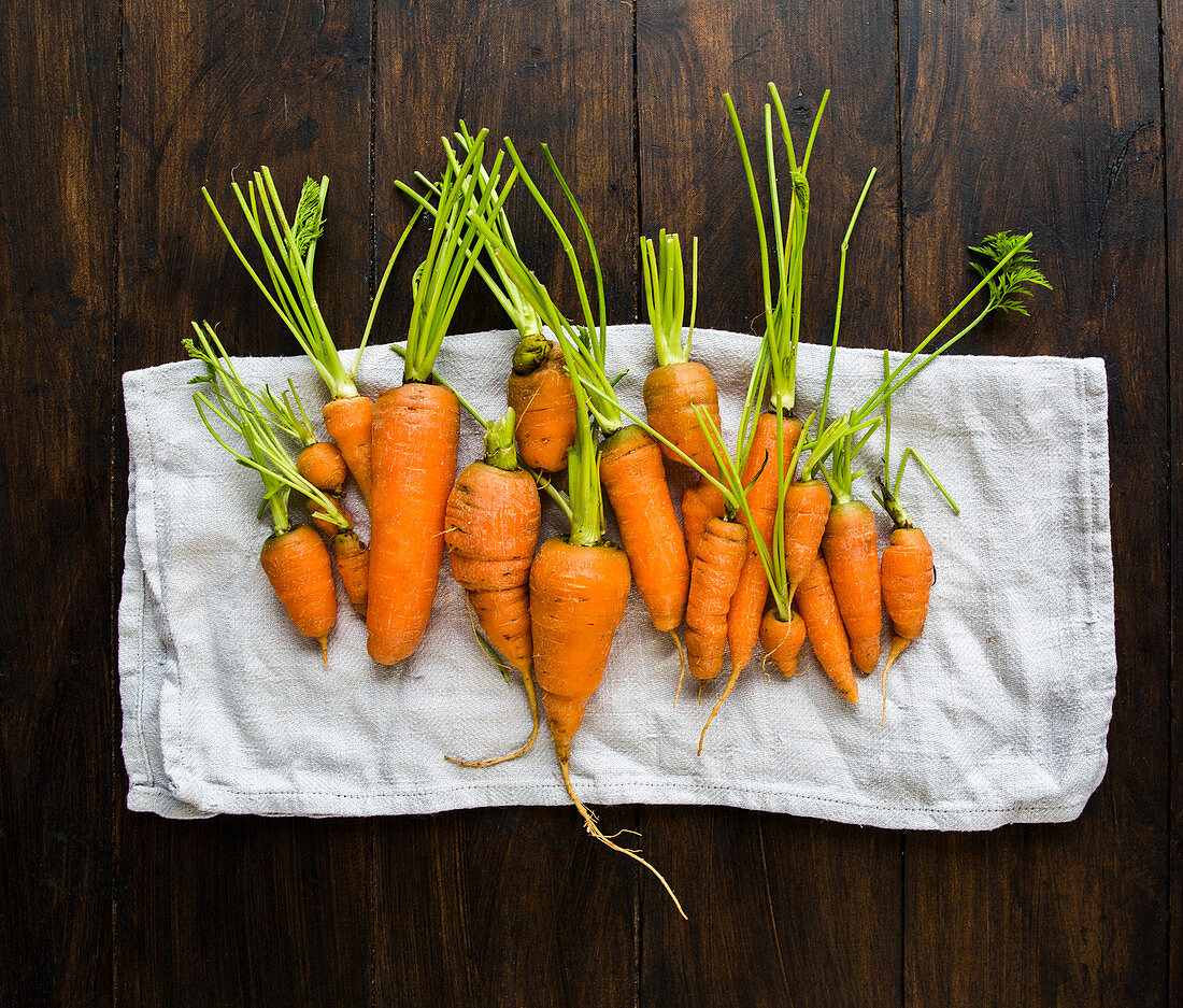 Small garden carrots in different shapes and sizes