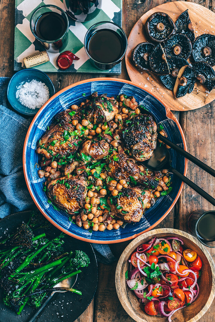 Braised chicken with chickpeas and pancetta, served with mushrooms, tomato salad and broccoli