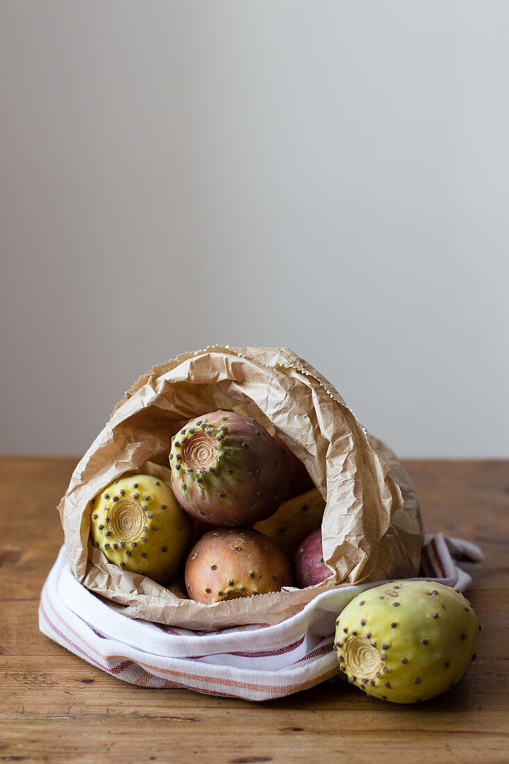 Prickly pears in a paper bag