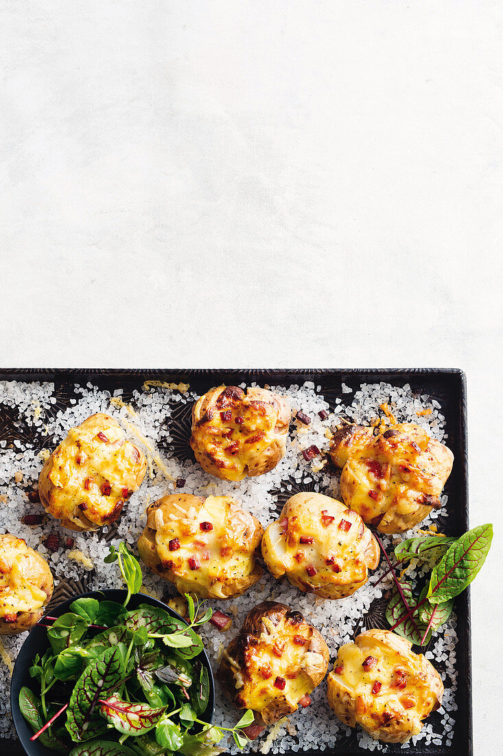 Croque monsieur jacket potatoes on a baking tray