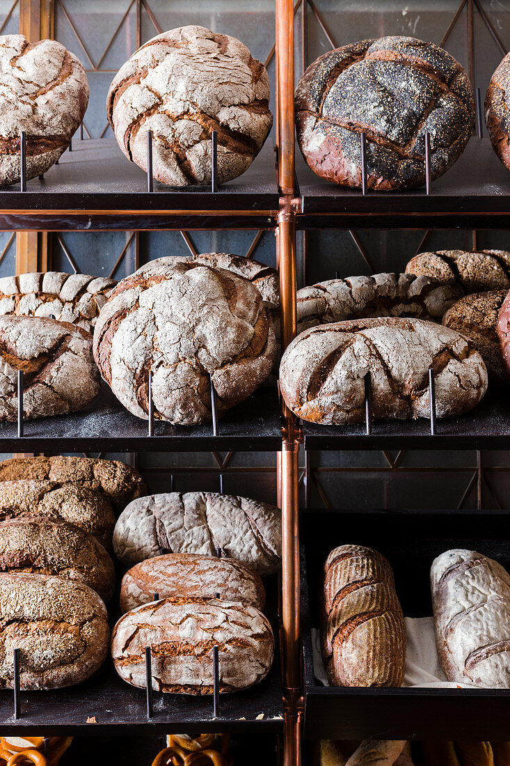 Artisan wood-fired bread loaves on shelves