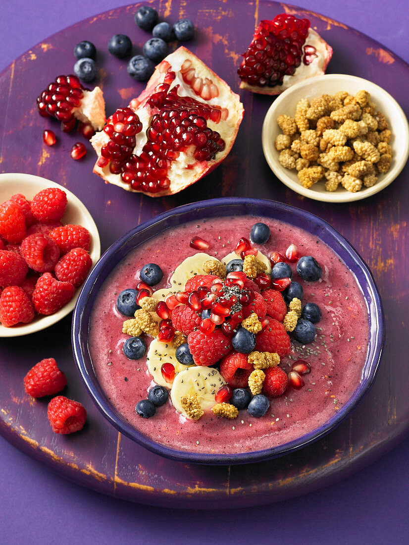 A pomegranate smoothie bowl with berries