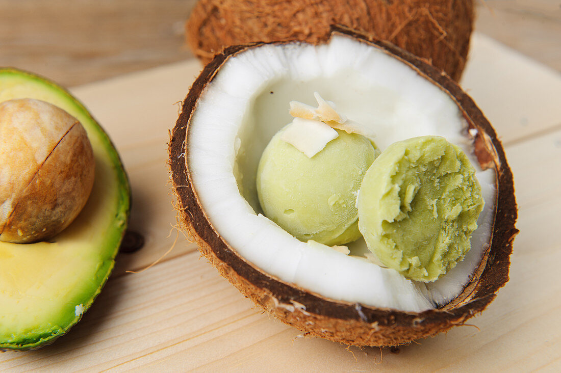 Avocado and coconut ice cream served in a coconut half