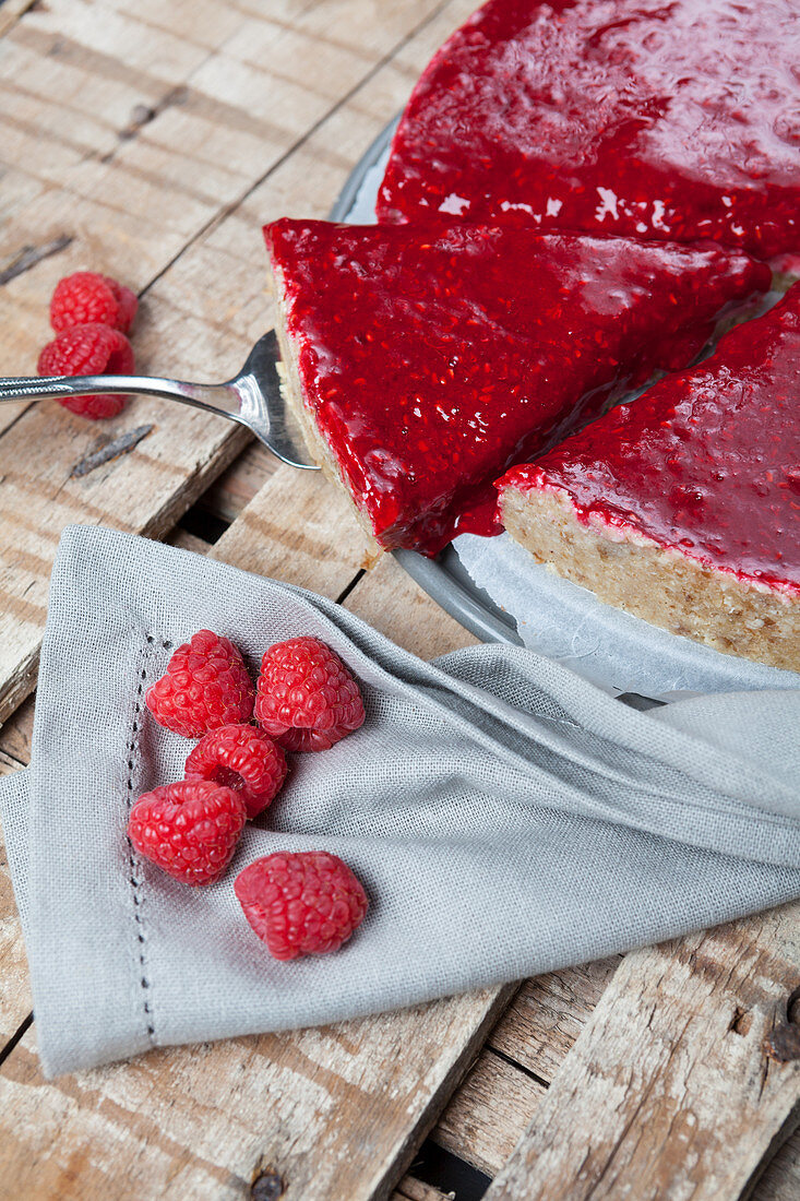 Raw, vegan cashew nut cheesecake with a raspberry topping