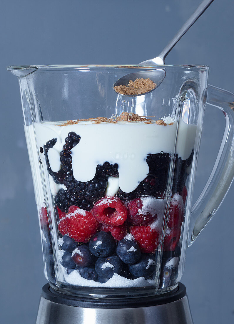 Ingredients for frozen yoghurt with berries in a blender