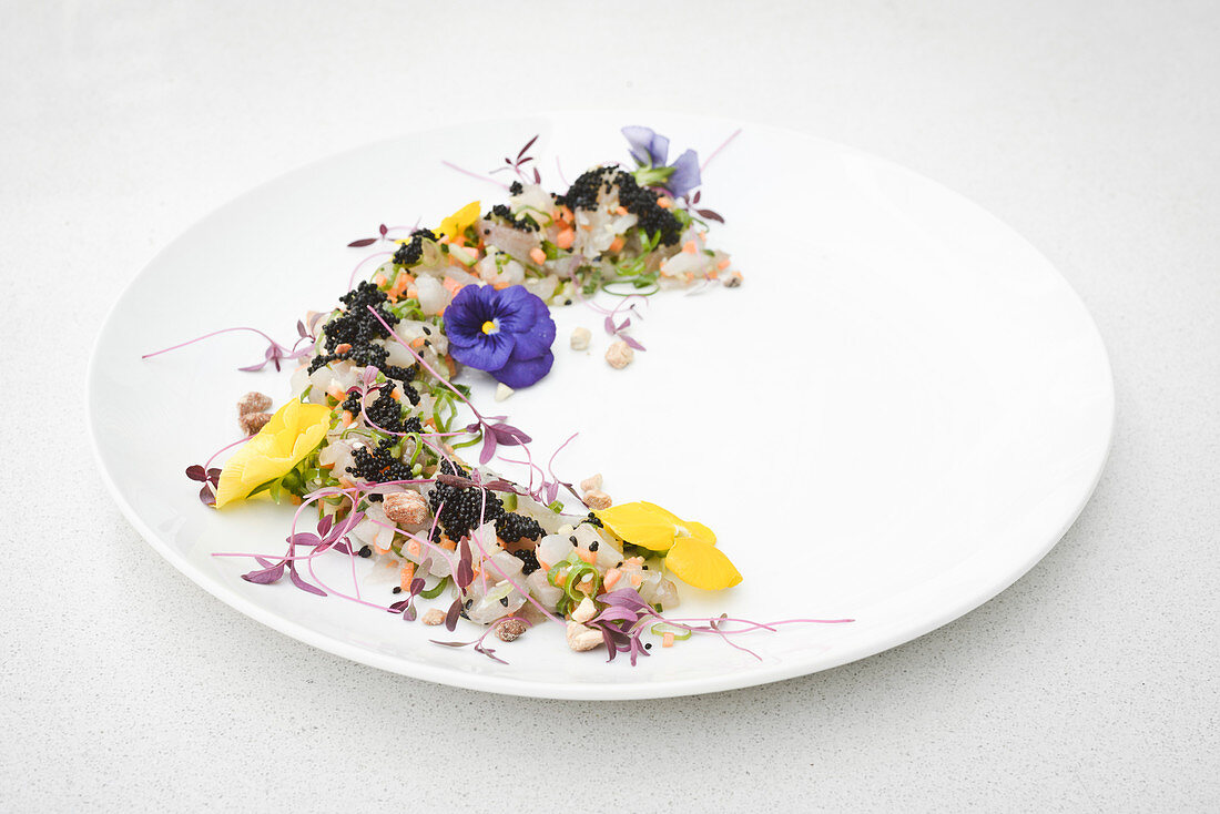Ceviche with caviar and edible flowers