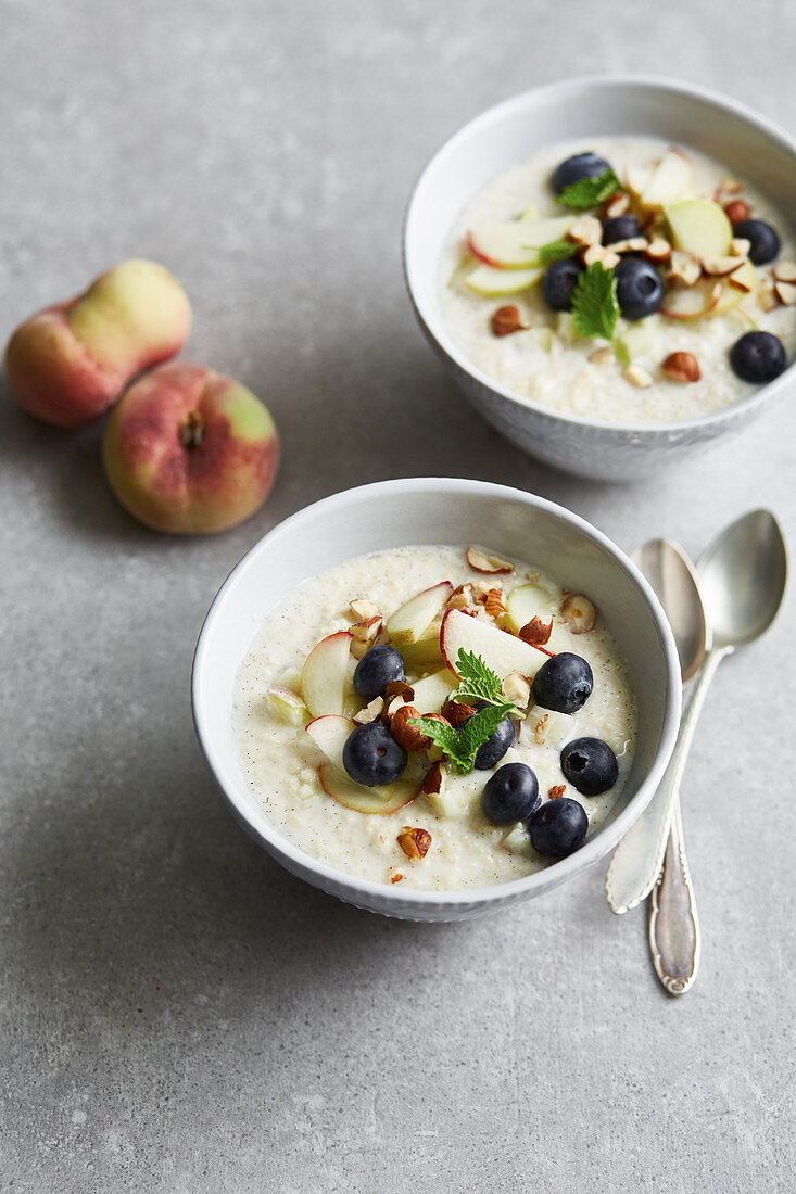 Cold millet soup with blueberries and peaches