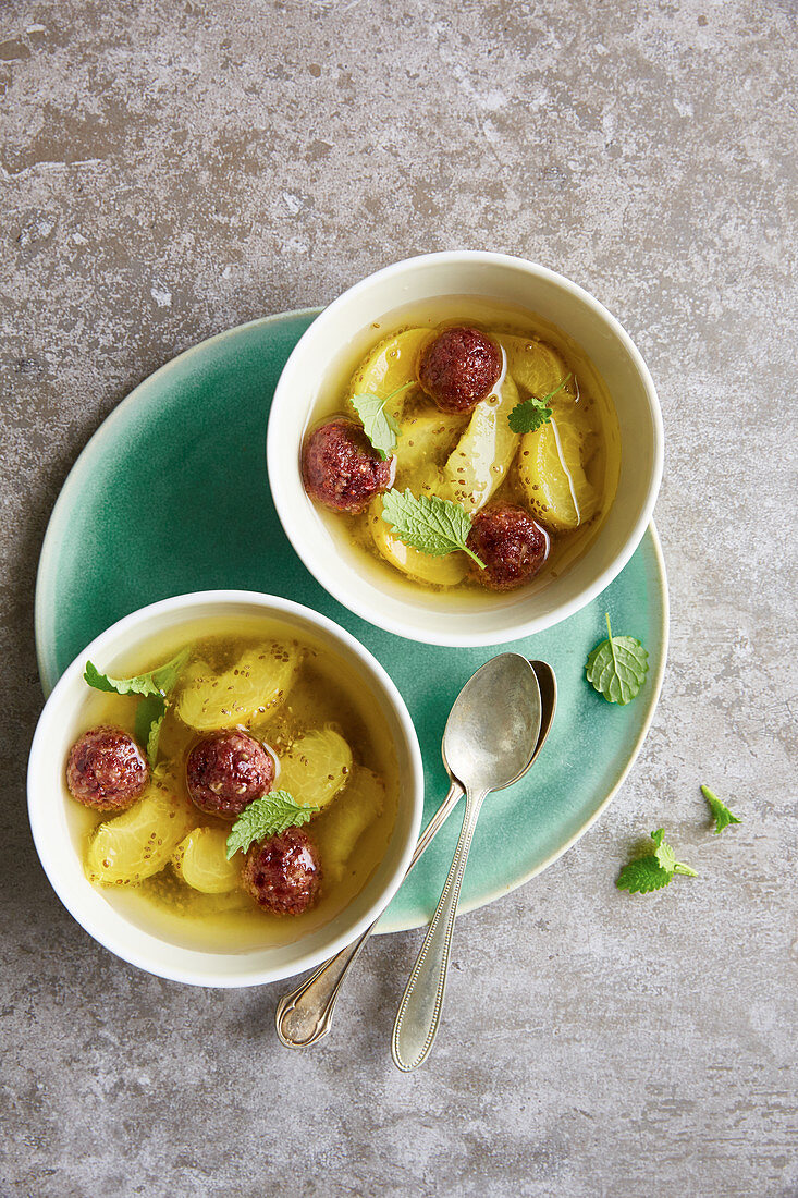 Chilled apricot soup with chia and cranberry chocolate pralines