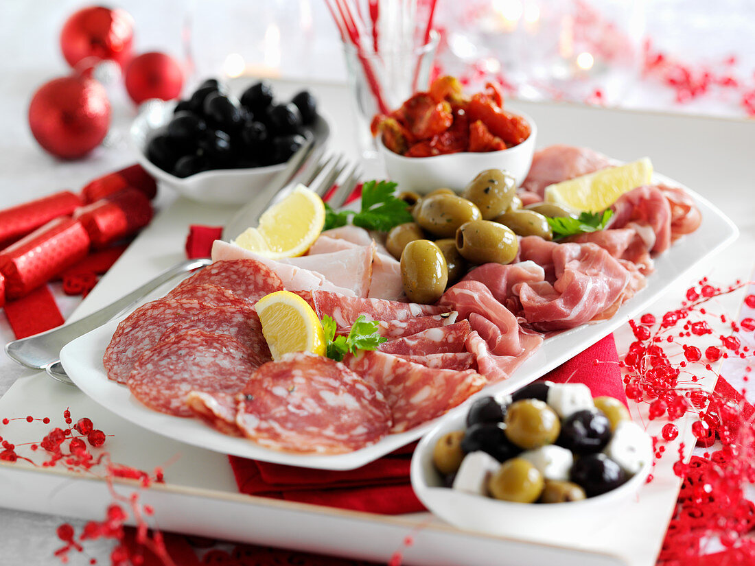 A festive sausage platter with olives for Christmas