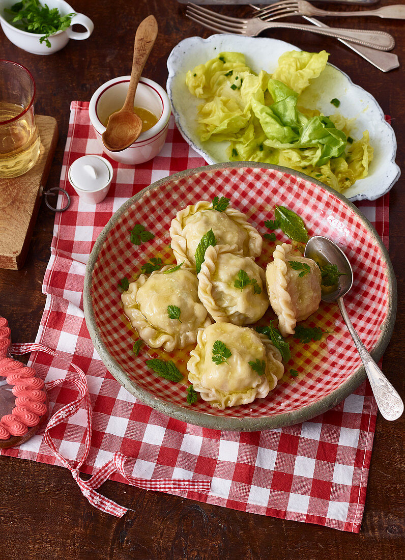 Kärntner Kasnudeln (Austrian ravioli filled with quark and potatoes) with lettuce