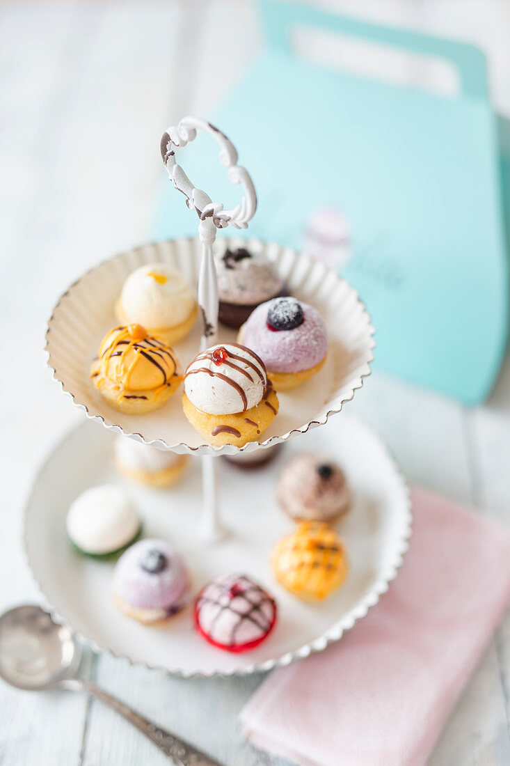 Various mini cupcakes on a cake stand