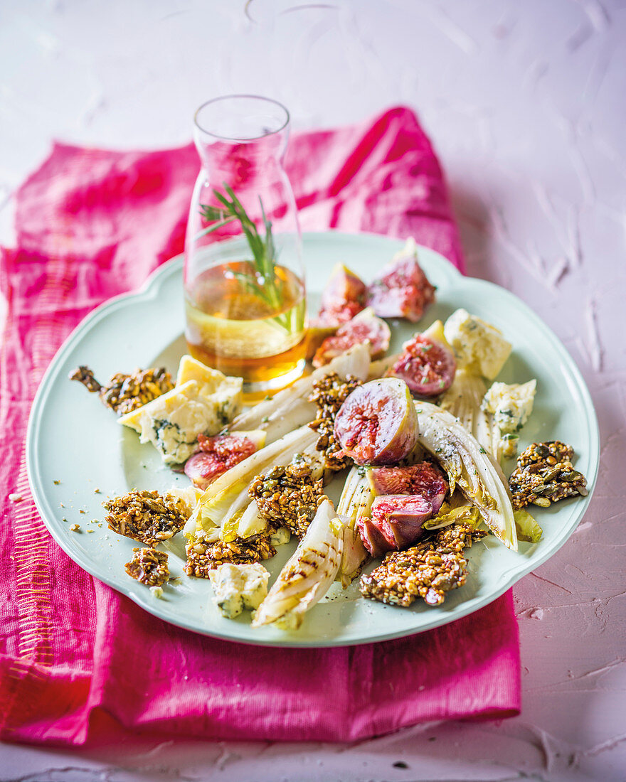 Grilled chicory with figs and seed brittle