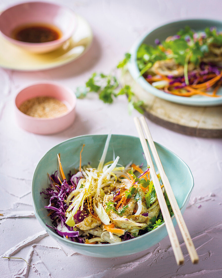 Chicory salad with chicken, carrots, red cabbage and sesame seeds