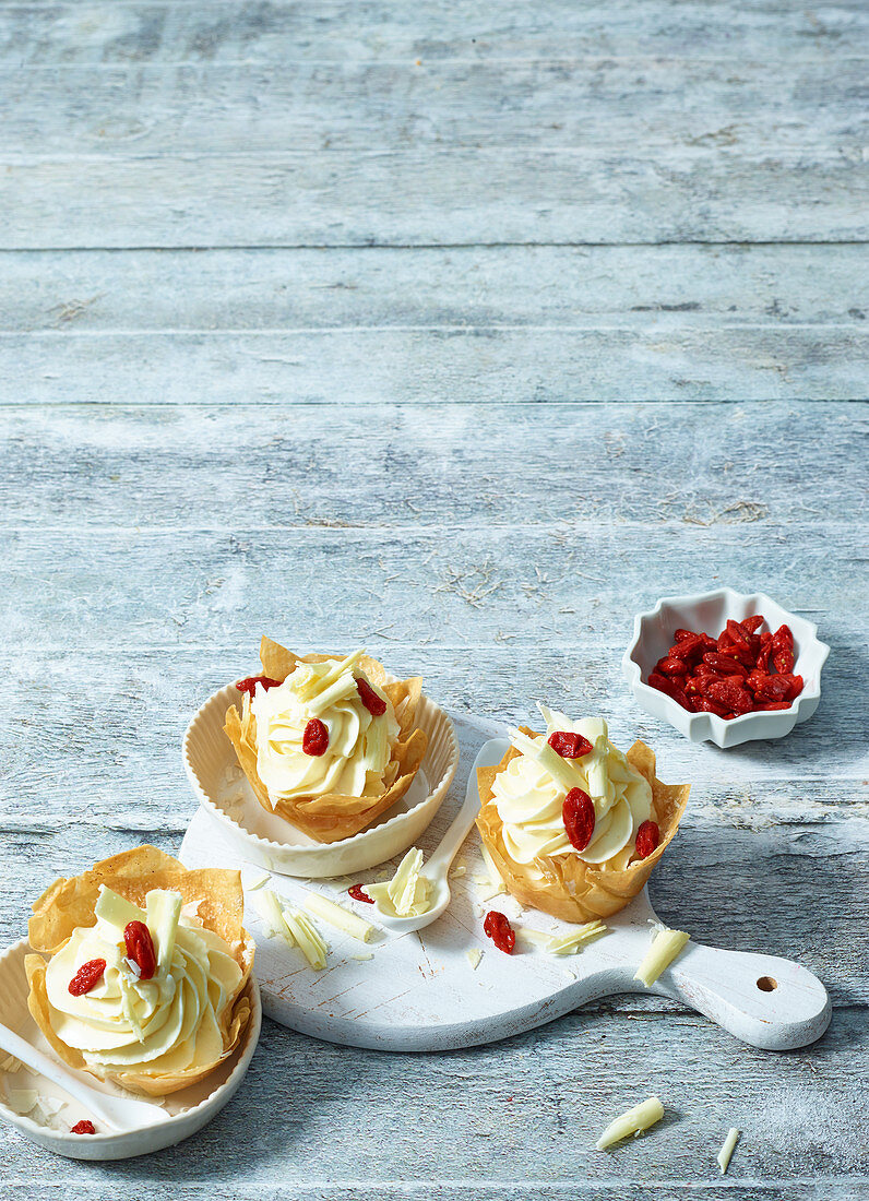 White chocolate and pear cream with goji berries in pastry shells